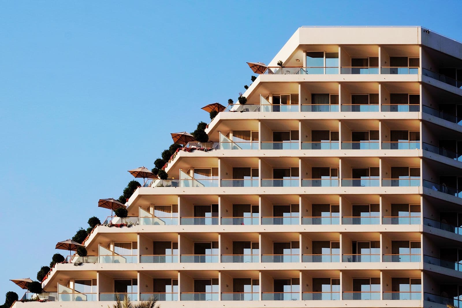 A hotel building with terraced balconies